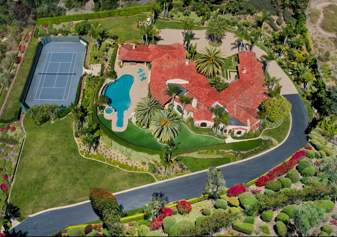 Aerial view of a house with decorated pools