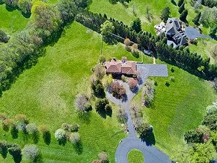 An aerial shot of a property with greeneries