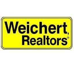 A yellow logo of Weichert Realtors is shown here