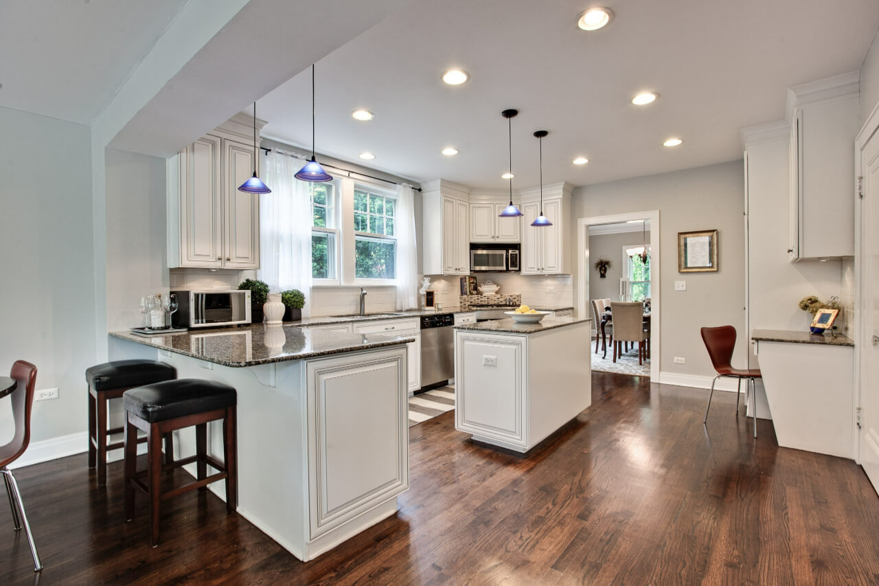 A kitchen area with sleek design